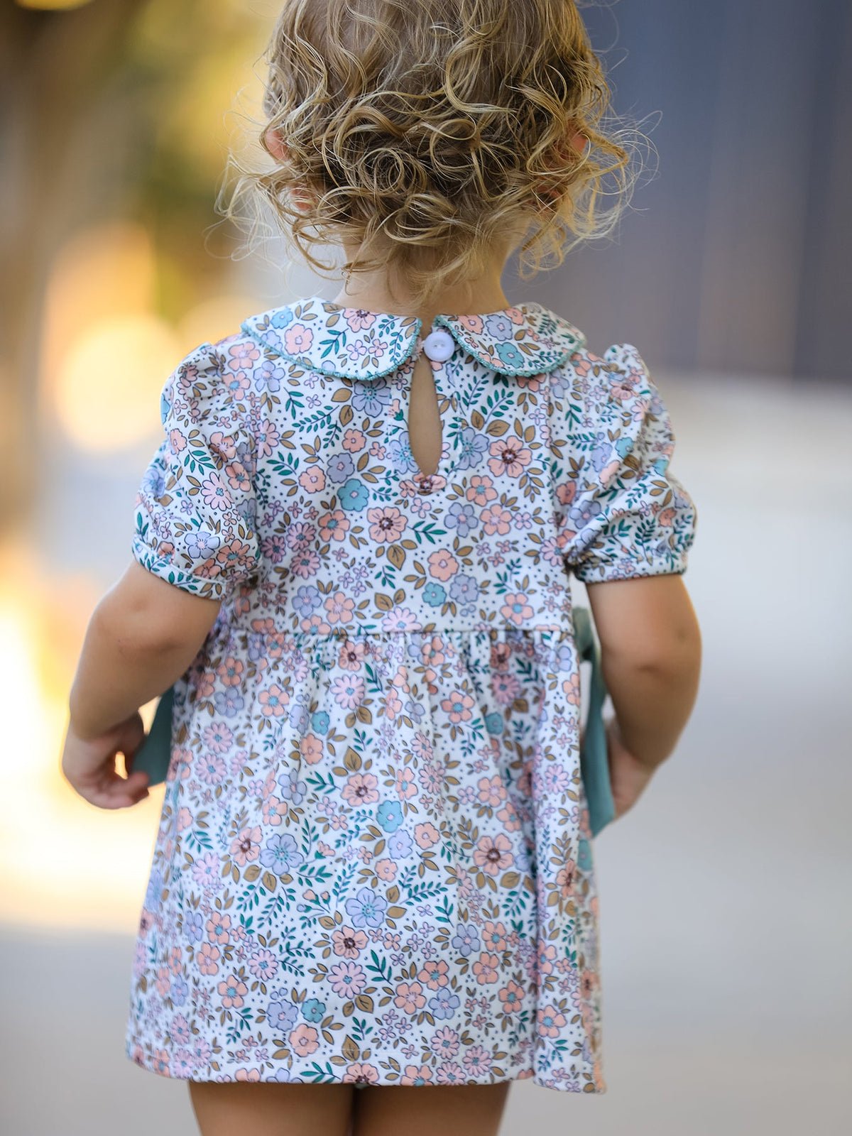 a child wearing a dress