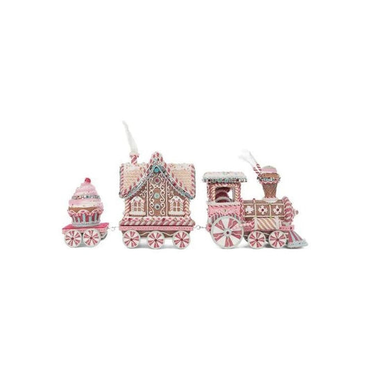 a gingerbread train with a cupcake and a gingerbread house
