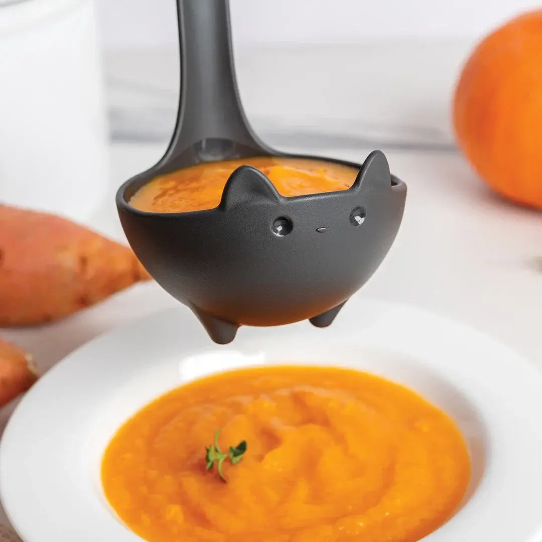 a spoon in a bowl of soup