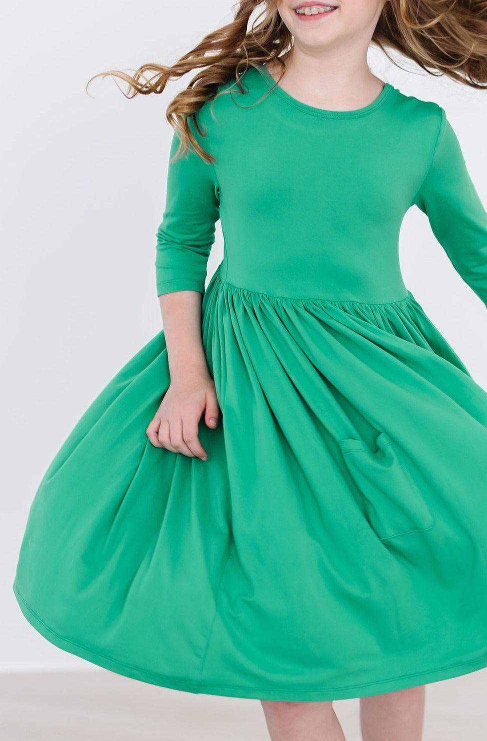 a woman in a green dress