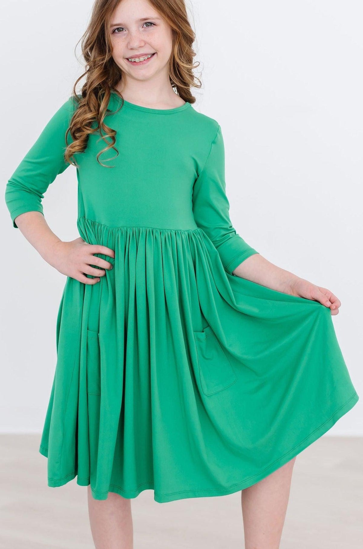 a girl in a green dress
