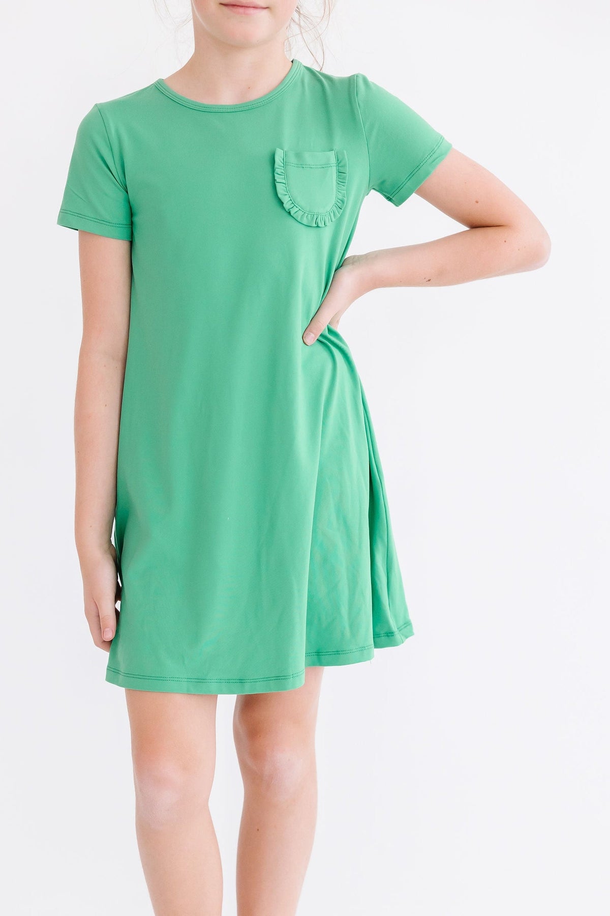 a girl in a green dress
