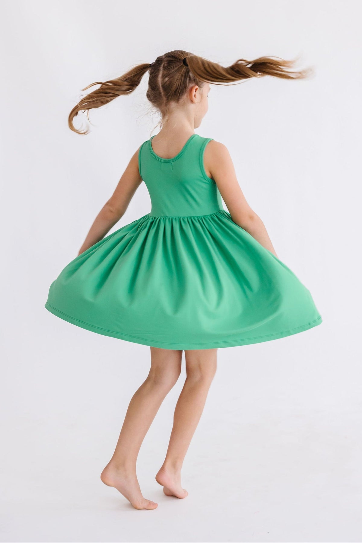 a girl in a green dress