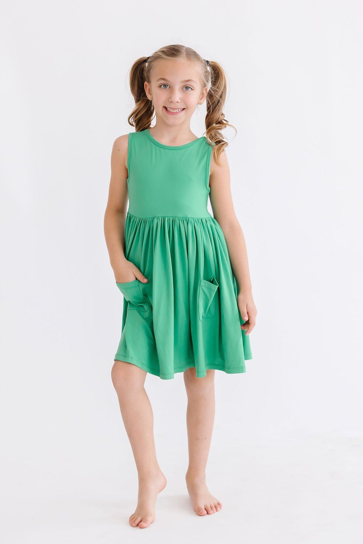 a girl in a green dress