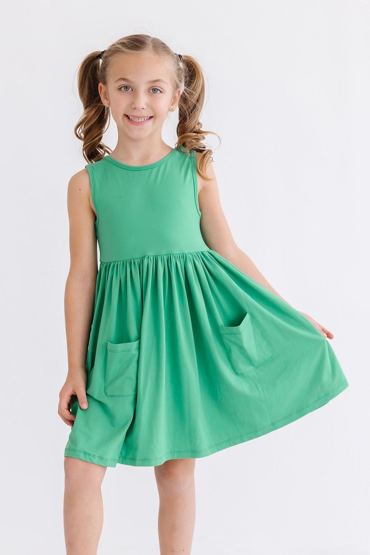 a girl in a green dress
