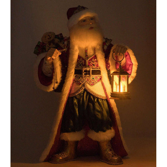 a man in a garment holding a lantern