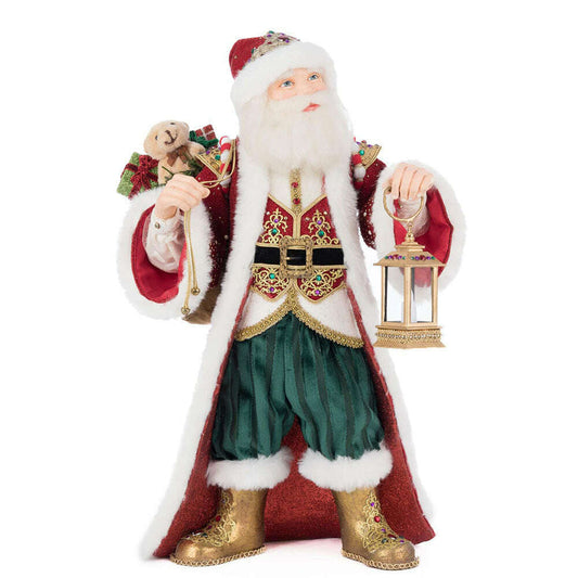 a statue of a santa holding a lantern and a bear