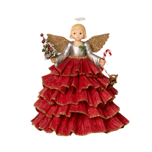 a christmas ornament of a girl in a red dress