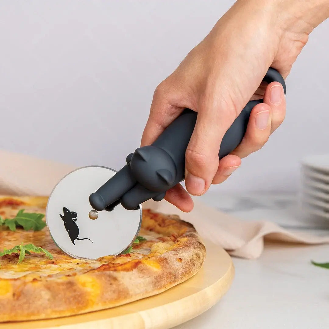 a person cutting a pizza with a mouse cutter