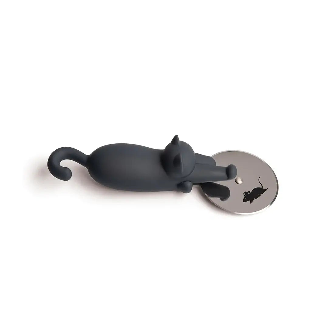 a grey cat figurine on a silver coin