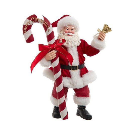a santa claus holding a candy cane
