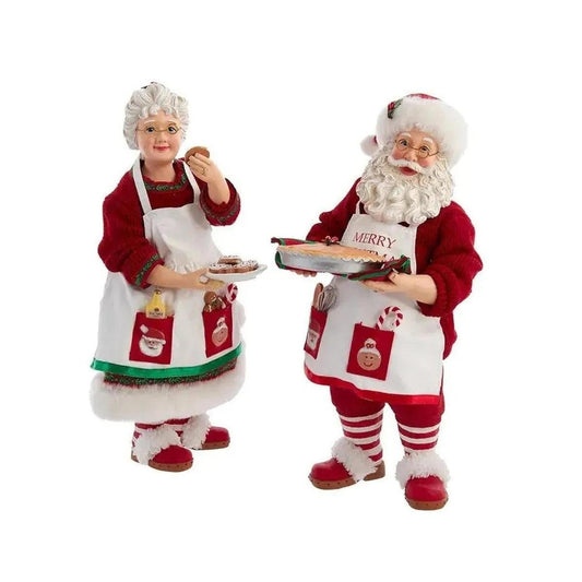 a couple of santa claus figurines