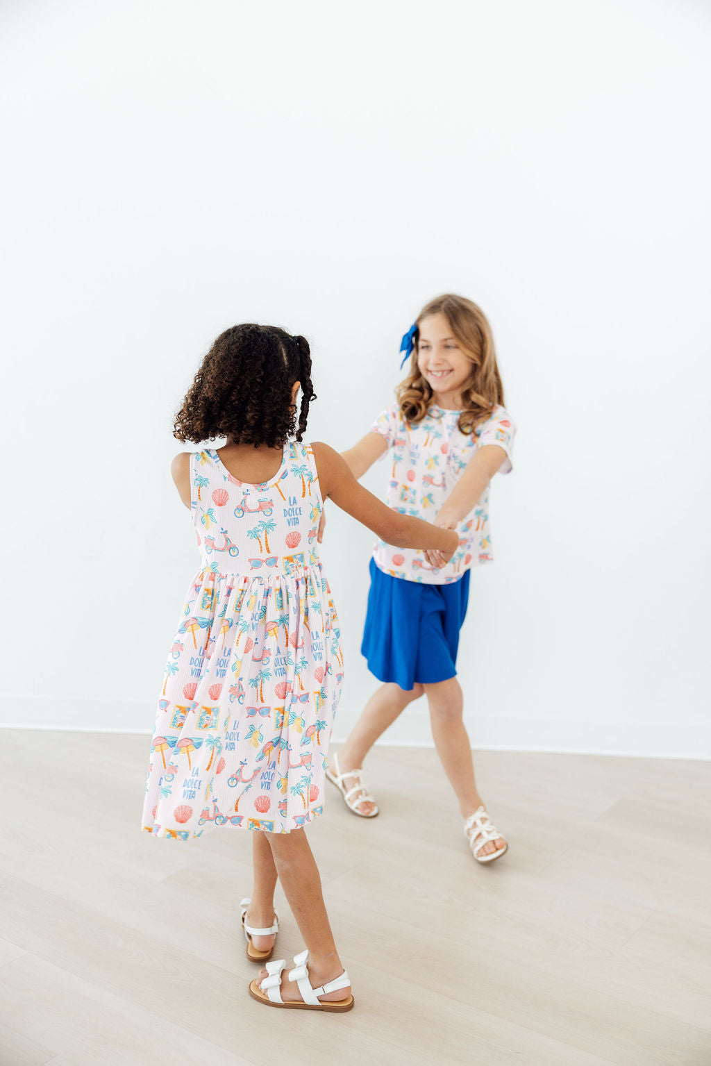 two girls dancing in a room