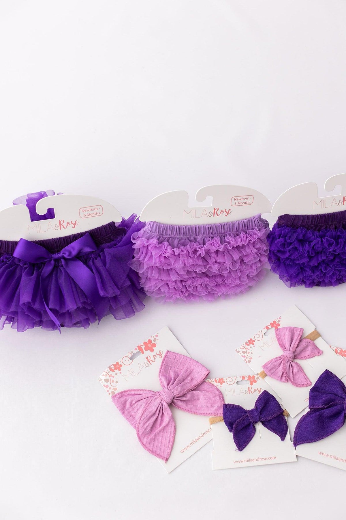 a group of purple and pink tutu skirts