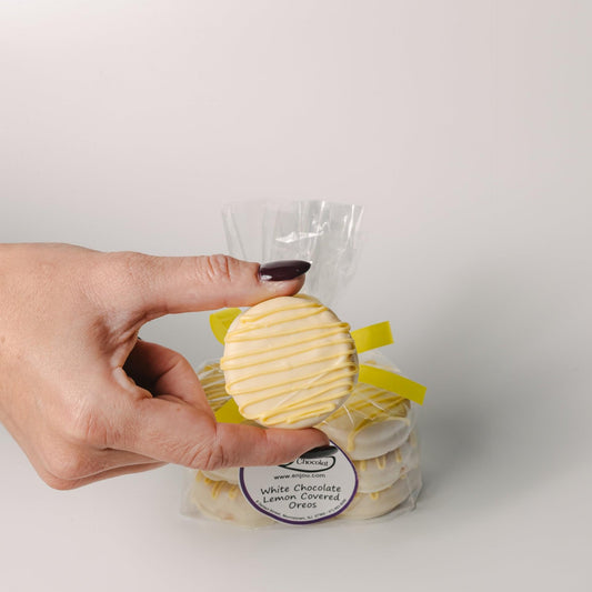 a hand holding a cookie