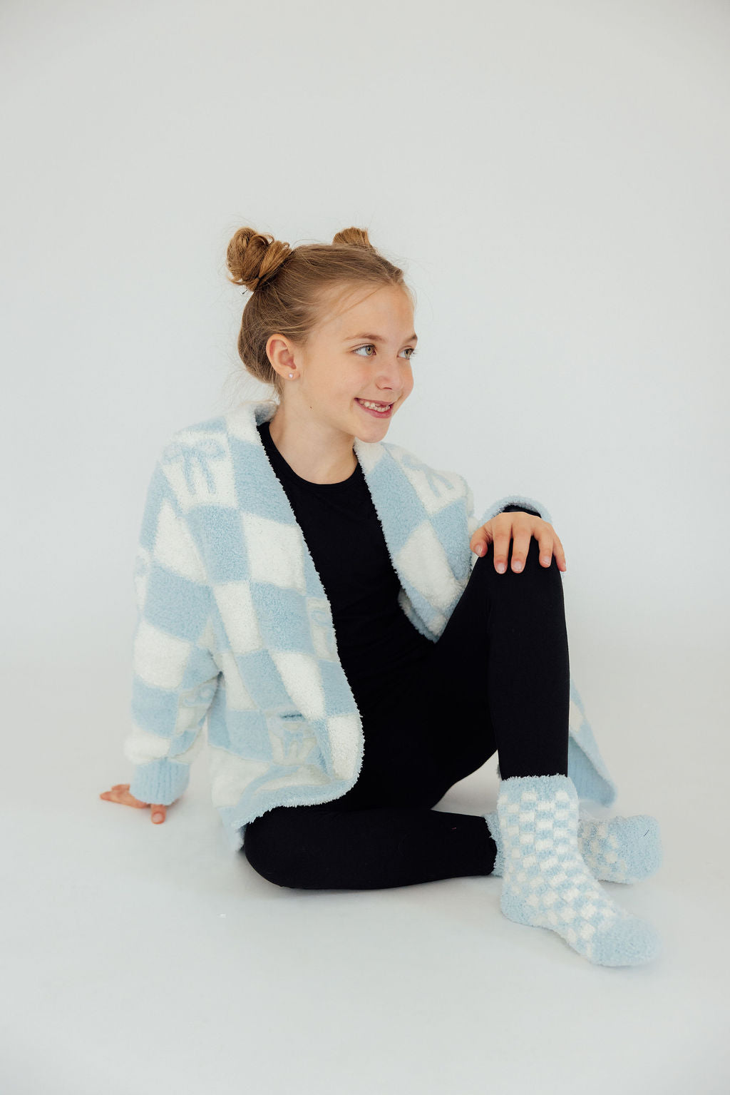 a girl sitting on the floor