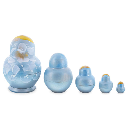 a group of blue and white nesting dolls