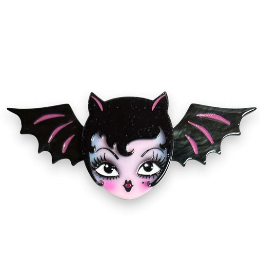a pin with a bat face