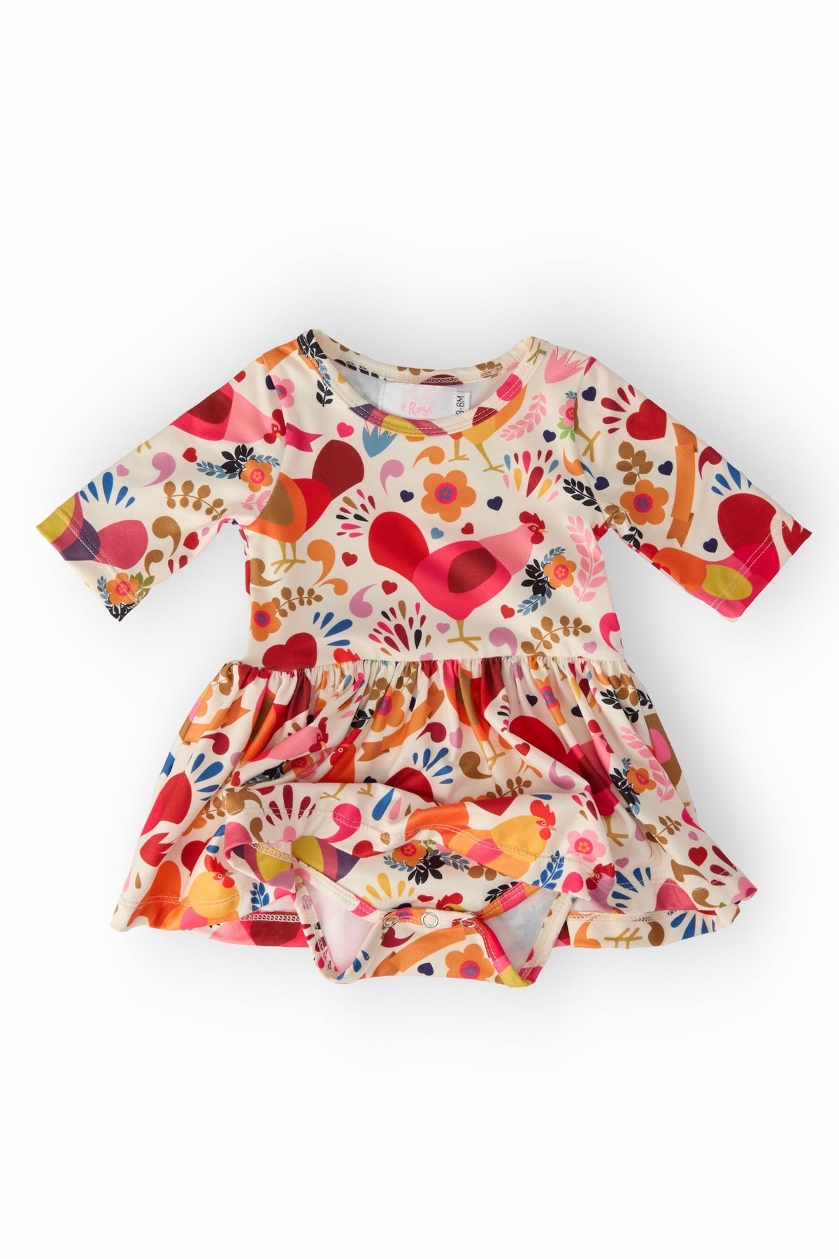 a baby dress with birds on it