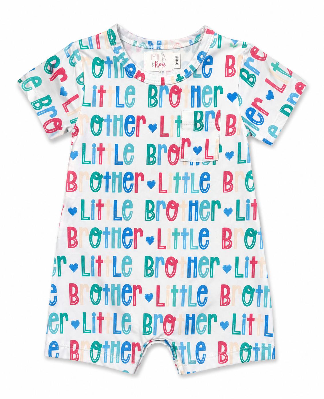a white romper with multicolored letters on it