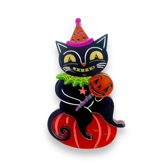 a black cat with a hat and pumpkin