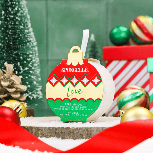 a christmas ornament on a wood block