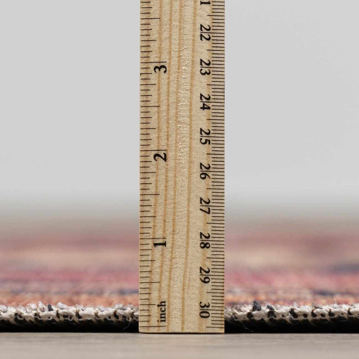 a wooden ruler on a rug