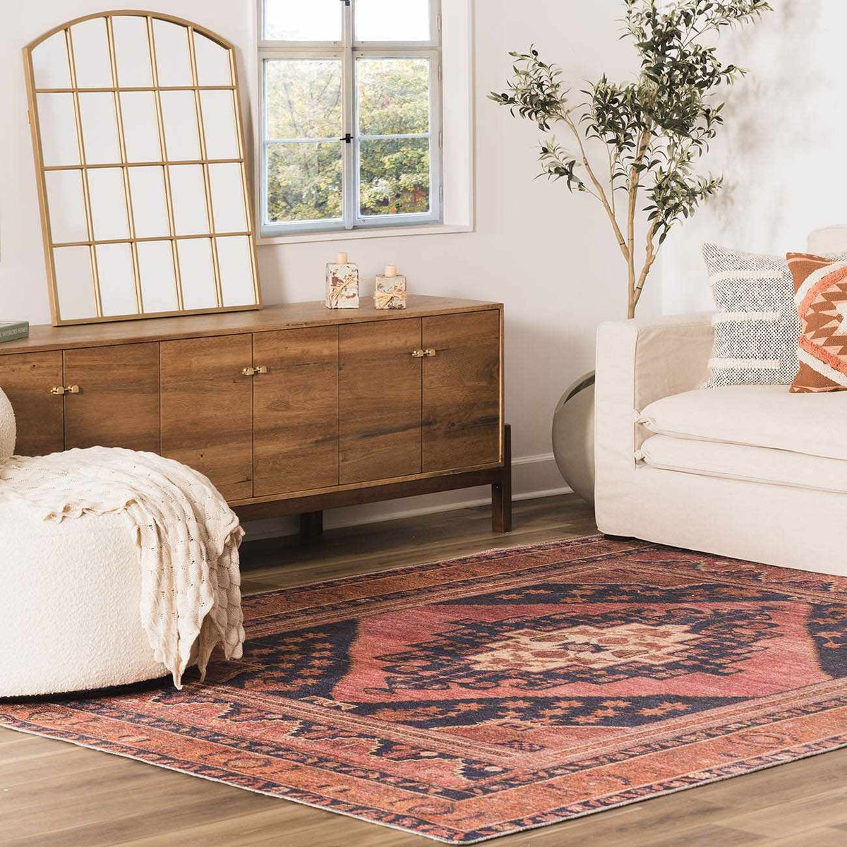 a living room with a rug and couch