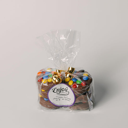 a bag of chocolate cookies with candy in it