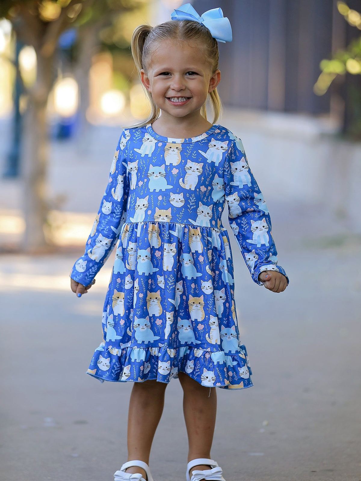 a girl in a blue dress