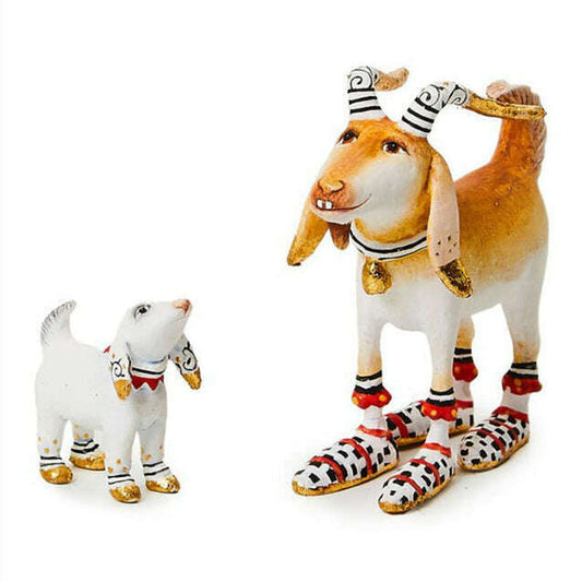 a statue of a dog and a dog wearing shoes