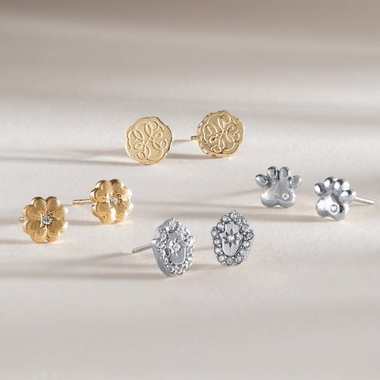a group of earrings with a paw print and a paw print