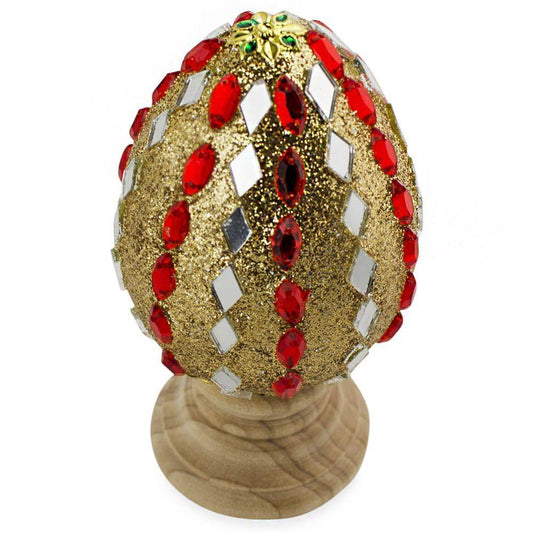 a gold and red decorated egg