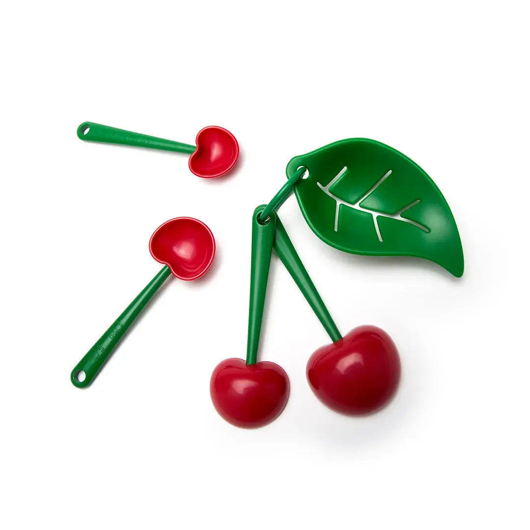 a group of plastic spoons with red cherries