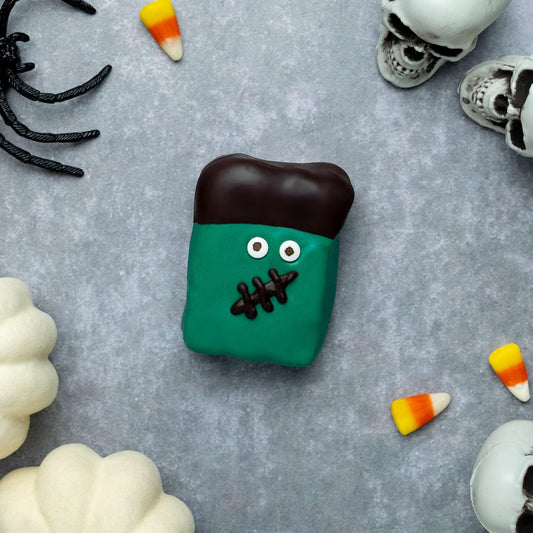 a candy and skulls on a grey surface