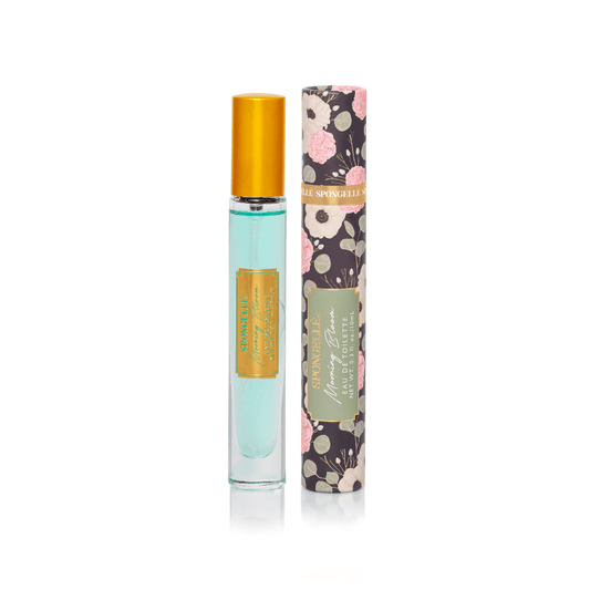 a bottle of perfume next to a tube of perfume