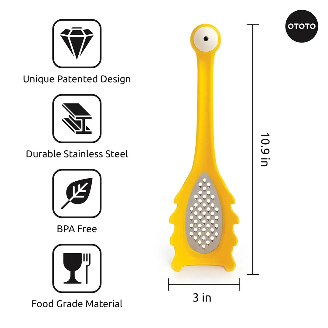 a yellow grater with a white eye