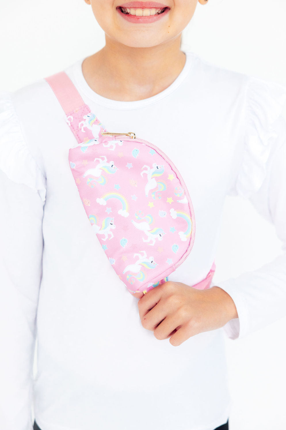 a girl wearing a pink bag