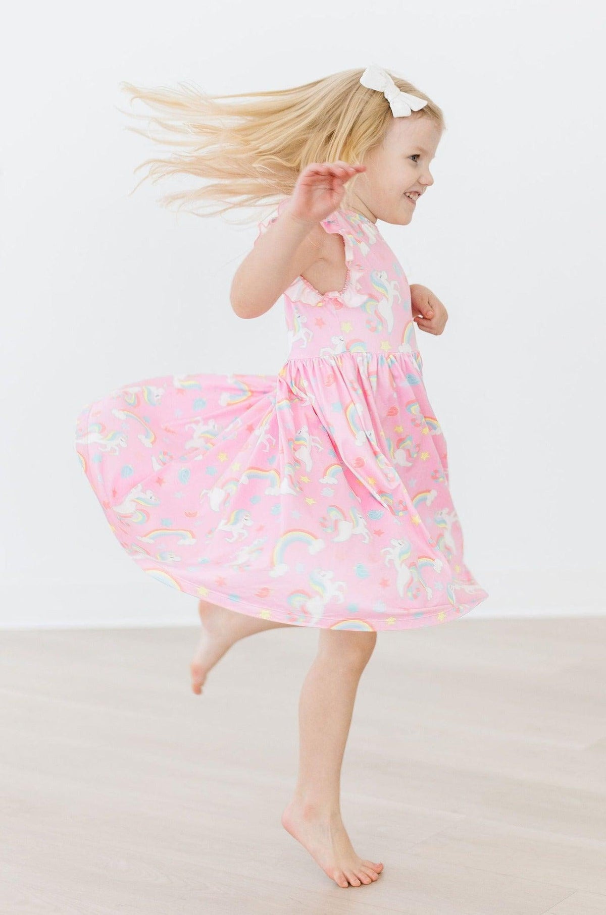 a girl in a pink dress