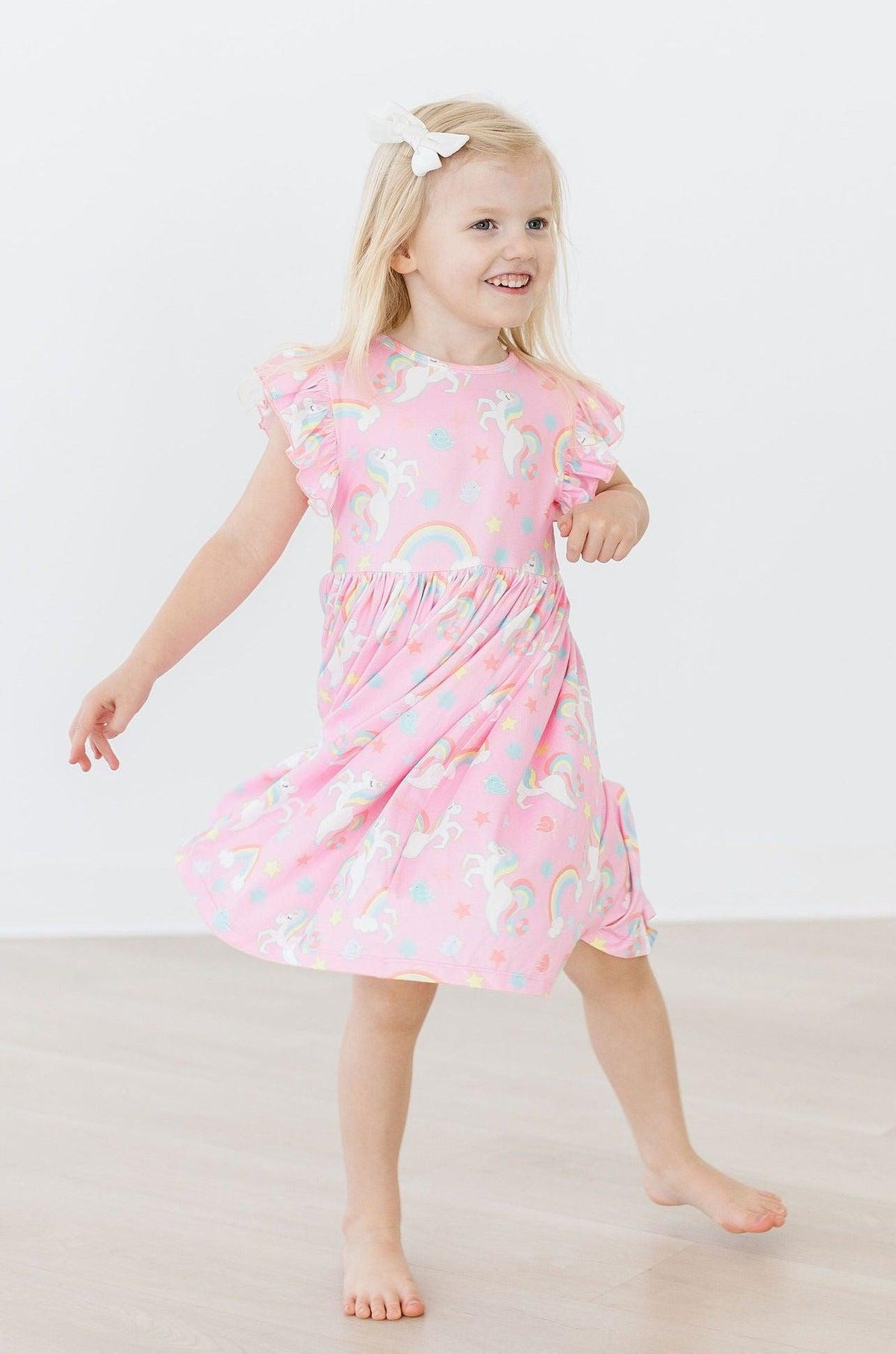 a girl in a pink dress