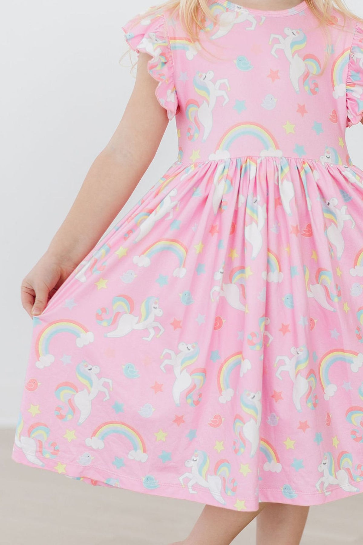 a girl wearing a pink dress