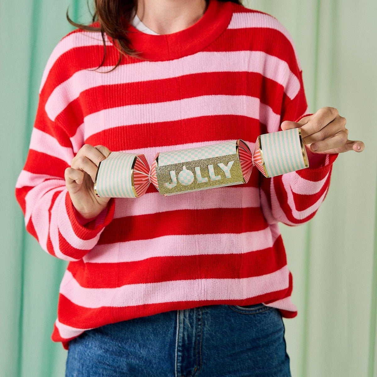 a woman holding a cracker