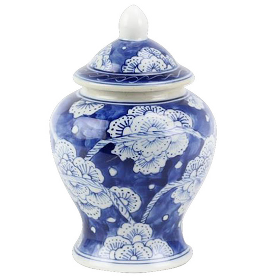 a blue and white vase with a lid