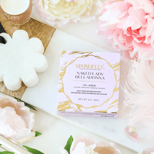 a box of makeup on a table with flowers