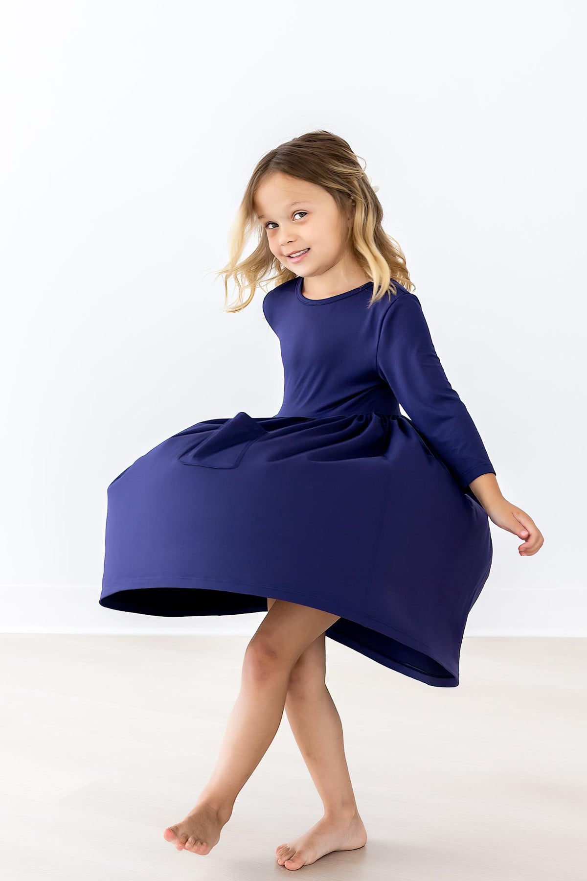 a girl in a blue dress