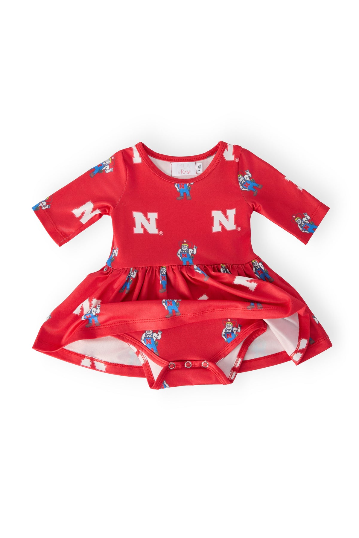 a red baby dress with white letters on it