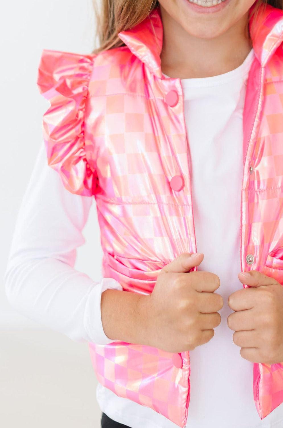a close up of a girl's pink jacket