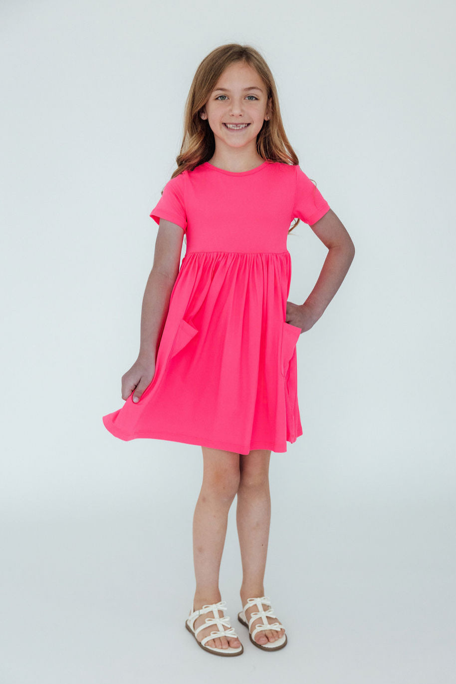 a girl in a pink dress