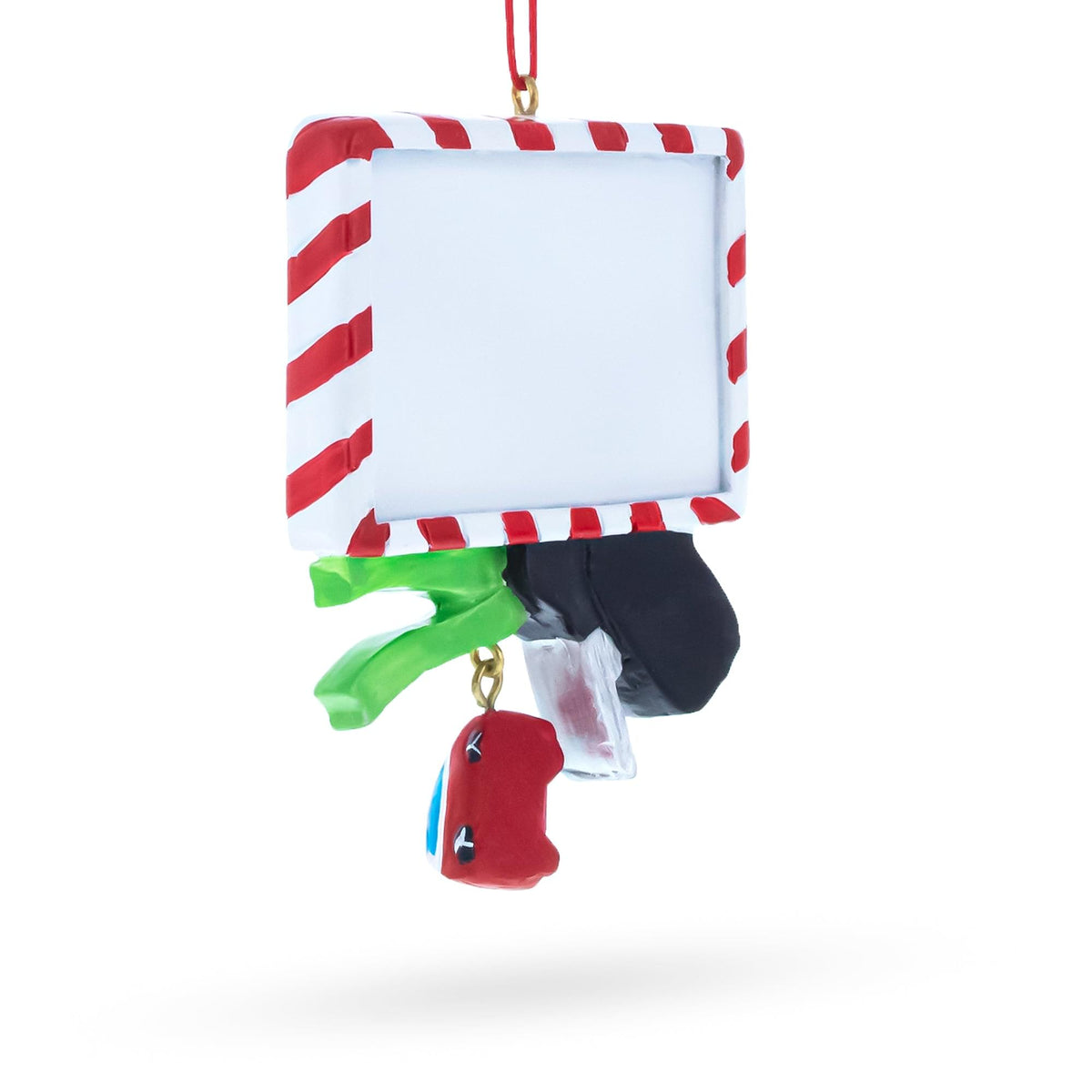 a christmas ornament with a red and white striped frame