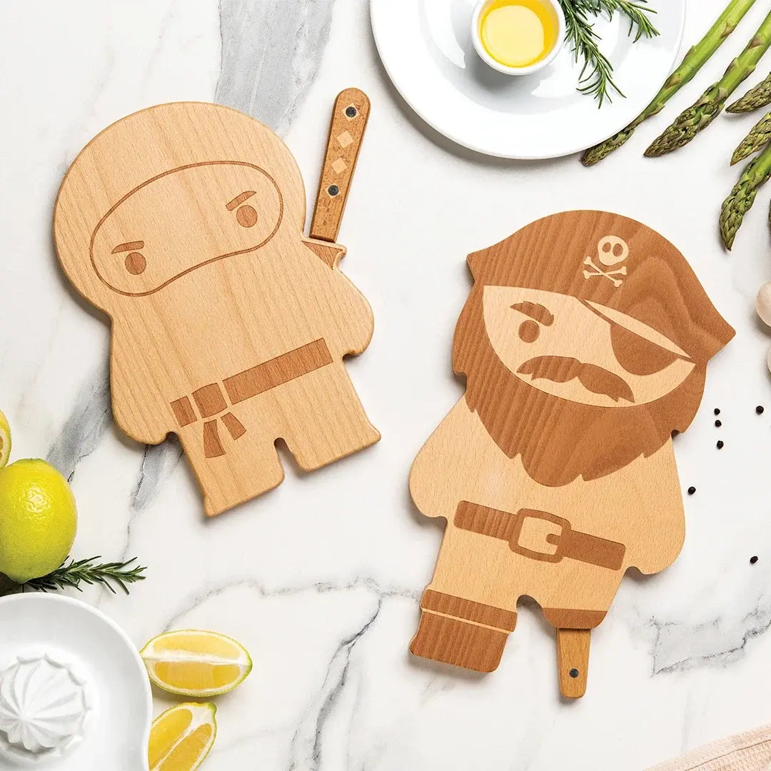 a wooden cutting boards with a cartoon character on it next to a plate of food